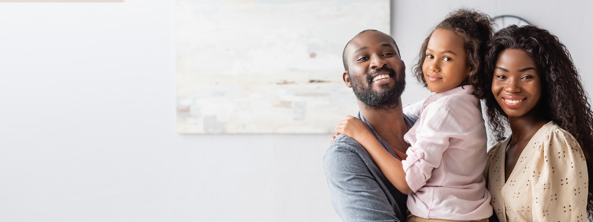 Family smiling at the camera